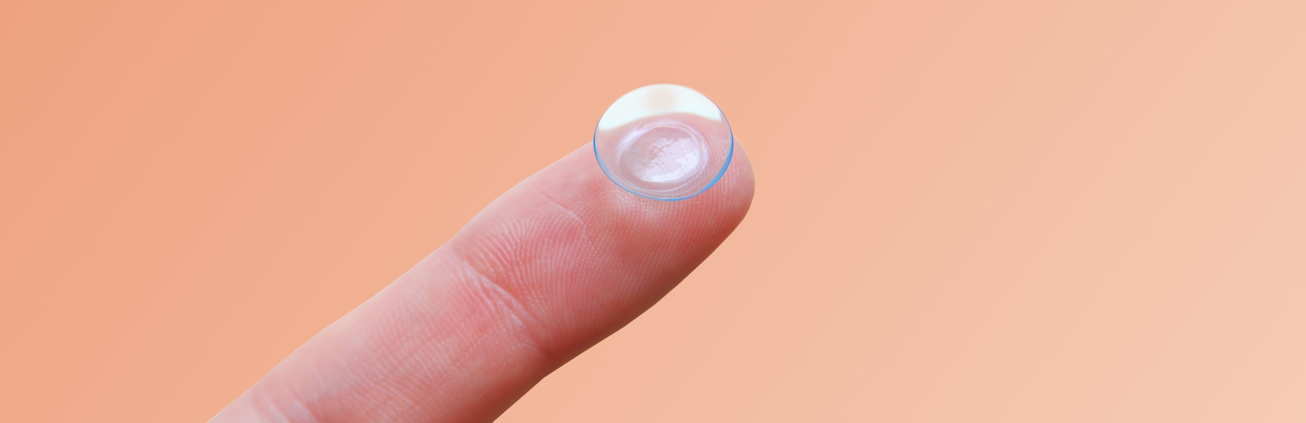 What does a torn contact lens look like and feel like?